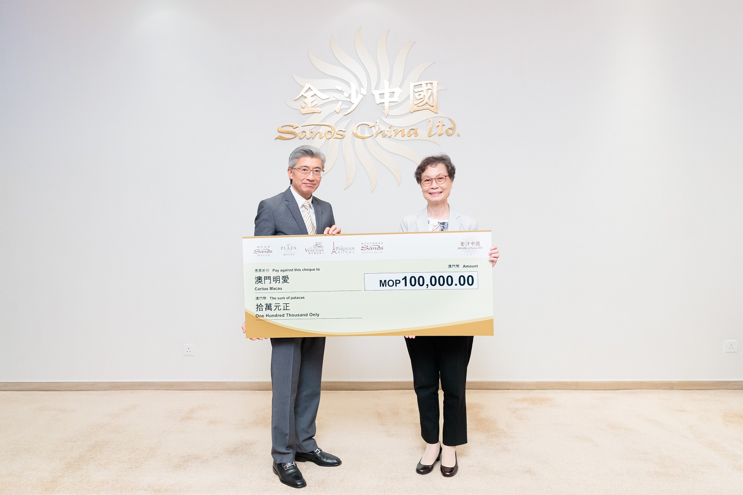 Sands China Presents Light the Night Run Donation Cheques 