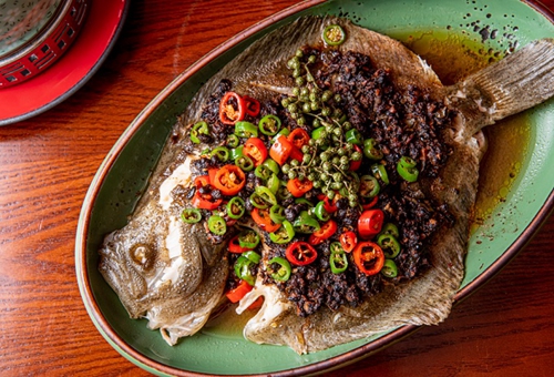 Steamed turbot with black bean and green peppercorn sauce